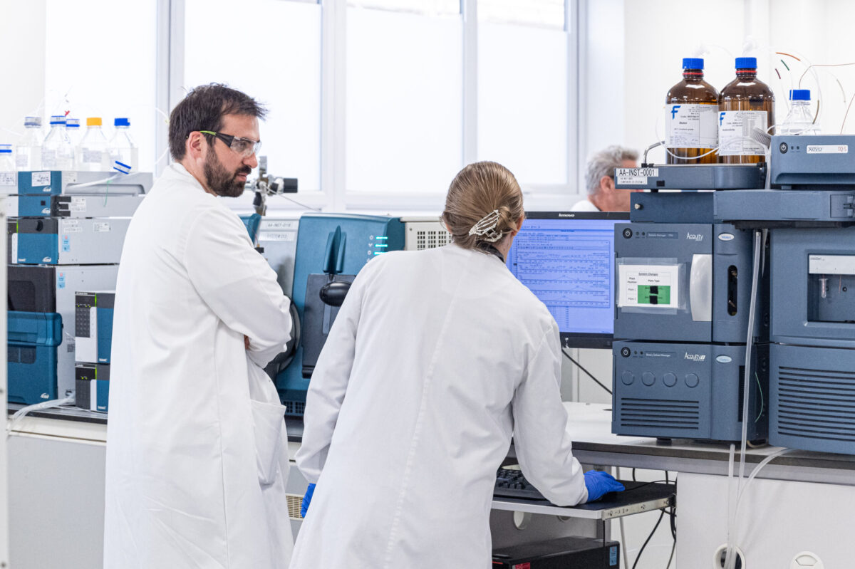 Scientists working in a laboratory setting.